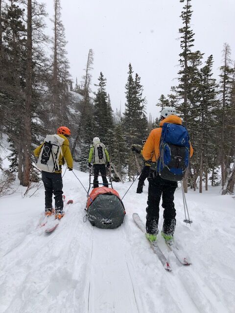 RMNP Search and Rescue Team Members February 9 with patient in Rescue Toboggan Courtesy Rocky Mountain National Park.jpg